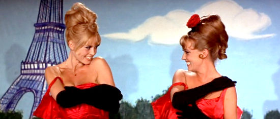 Brigitte Bardot as Maria II and Jeanne Moreau as Maria I, enjoying their new routine in Viva Maria! (1965)