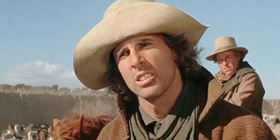 Bruce Dern as Asa Watts, asking for a job as a cowhand on Will Anderson's cattle drive in The Cowboys (1972)