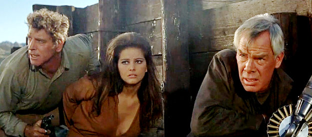 Burt Lancaster as Dolworth, Claudia Cardinale as Maria and Lee Marvin as Farden during a shoot-out with Raza's men in The Professionals (1966)