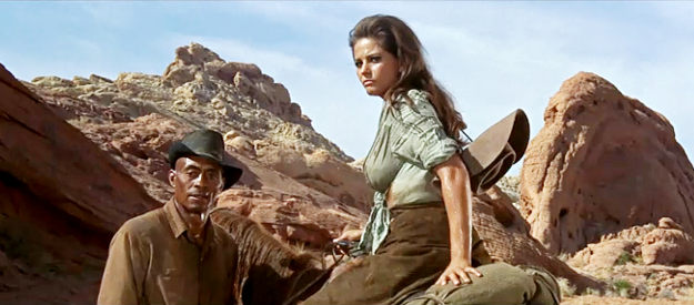 Claudia Cardinale as Maria and Woody Strode as Jake, watching a trap being laid for Raza in The Professionals (1966)