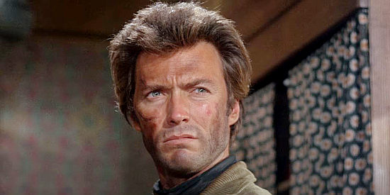 Clint Eastwood as Jed Cooper, about to accept a marshal's badge from the judge in Hang 'Em High (1968)