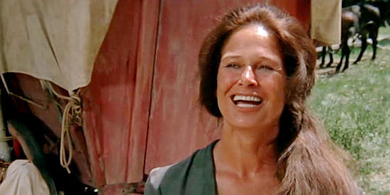 Colleen Dewhurst as Kate, teasing two young cowboys with a wagon full of soiled doves in The Cowboys (1972)