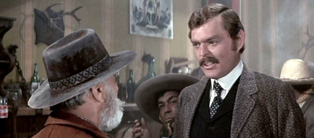 Edward Faulkner as James J. Dolan, one of Murphy's business associates in Chisum (1970)