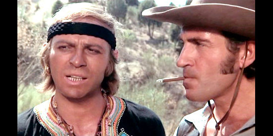 Ennio Girolami (Thomas Moore) as Mestizo with accomplice Billy (Mariano Vida Molina) discussing an attack on the wagons in Reverend Colt (1970)