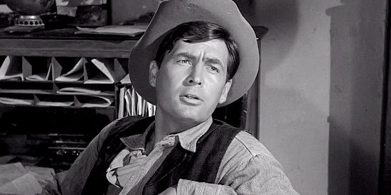 Fess Parker as Sheriff Buck Weston, learning what brought Mackenzie Bovard to his town in The Hangman (1959)