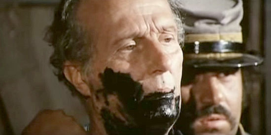 Filippo Perego as the Union major, forced to drink ink for signing death warrants for Rebel renegades in Fasthand is Still My Name (1973))