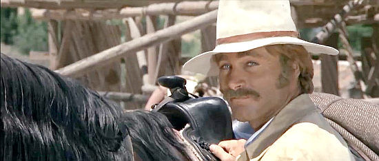 Franco Nero as The Swede, considering a proposition in Companeros (1970)
