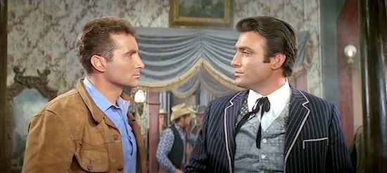Freddy Quinn as Freddy, aka Black Bill, and Perkins (Rik Battaglia) have words over a blonde saloon singer in The Sheriff was Lady (1964)