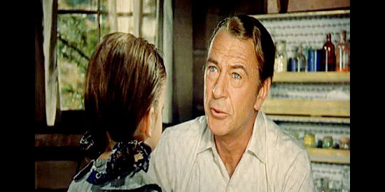 Gary Cooper as Doc Joe Frail, showing kindness to a malnourished young patient in The Hanging Tree (1959)