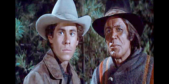 Gary Grimes as Danny and Neville Brand as the half-breed tracker Lightfoot, helping J.D. track down outlaws in Cahill, U.S. Marshal (1973)