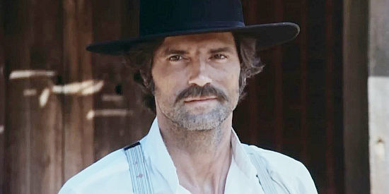 Geoffrey Land as Clay, the lawman Jessi wounds to free three female prisoners in Jessi's Girls (1975)