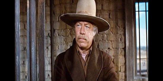 George Kennedy as Fraser, mastermind of a plan to rob the town bank while they're still behind bars in Cahill U.S. Marshal (1973)