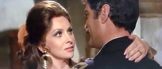 Gina Lollobrigida as Alicia, using her feminine charm on Col. Enrique Fierro (Sergio Fantoni) in Bad Man's River (1971)