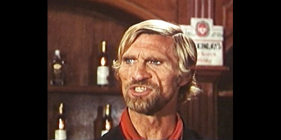 Gordon Mitchell as Chris, a stranger who finds his fast gun in high demand in Finders Killers (1971)
