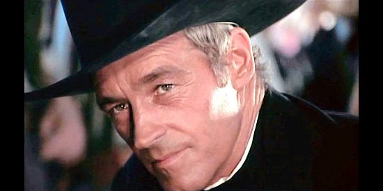 Guy Madison as Rev. Miller Colt, reflecting on his transformation from bounty killer to man of the cloth in Reverend Colt (1970)