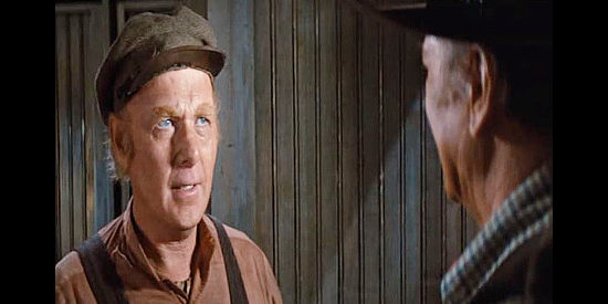 Harry Carey Jr. as Hank, caretaker at the jail, filling J.D. in on what's happened in Cahill, U.S. Marshal (1973)