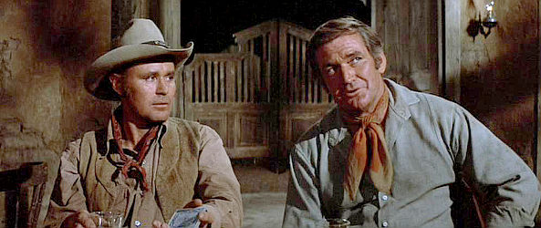 Jedrry Gatlin as Sam Turner and Rod Taylor as Grady as Lane explains the reason they've been called together in The Train Robbers (1973)