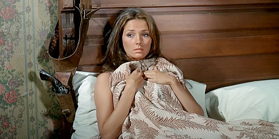 Jennifer O'Neil as Shasta Delaney, trying to figure out who removed her clothes when she fainted in Rio Lobo (1970)