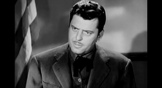 John Carroll as Glenn Forester, a man who fears his boss is going a bit too far in Wyoming (1947)