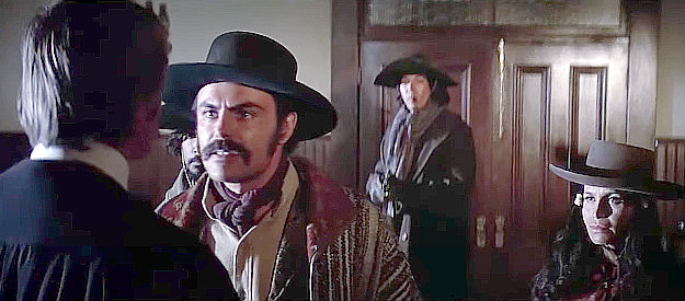John Saxon as Luis Chama, confronting the judge about the slow process of approving land grants in Joe Kidd (1972)