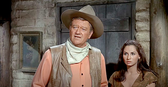 John Wayne as Cord McNally with Susana Dosamantes as Maria in Rio Lobo (1970)