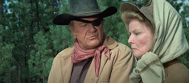 John Wayne as Rooster Cogburn and Katharine Hepburn as Eula Goodnight, getting to know one another better in Rooster Cogburn (1975)