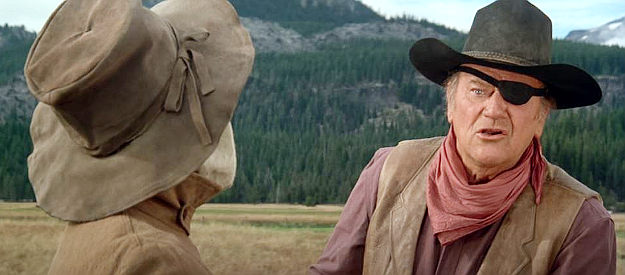 John Wayne as Rooster Cogburn, reacting to the idea of Eula helping track down her father's killers in Rooster Cogburn (1975)