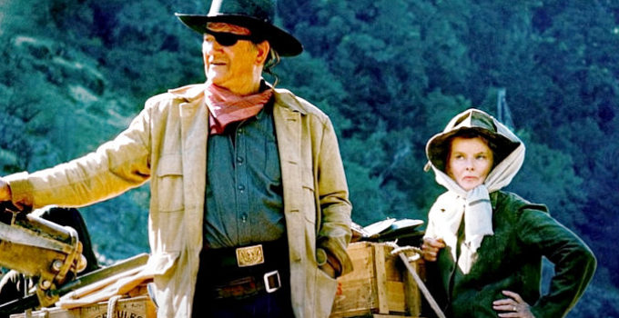 John Wayne as Rooster Cogburn with Katherine Hepburn as Eula Goodnight in Rooster Cogburn (1975)