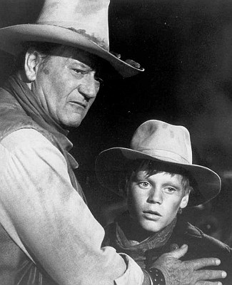 John Wayne as Wil Andersen with one of the cowboys in The Cowboys (1972)