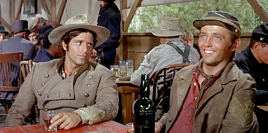 Jorge Rivero as Pierre Cordona with Chris Mitchum as Tuscarora, enjoying a post-war drink with Cord McNally in Rio Lobo (1970)