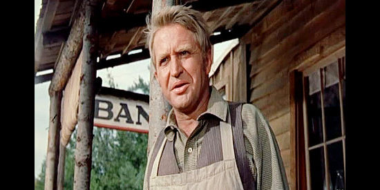 Karl Swenson as Tom Flaunce, owner of the general store and a friend to Doc Frail in The Hanging Tree (1959)