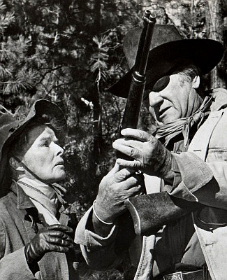 Katharine Hepburn as Eula Goodnight and John Wayne as Rooster Cogburn in Rooster Cogburn (1975)