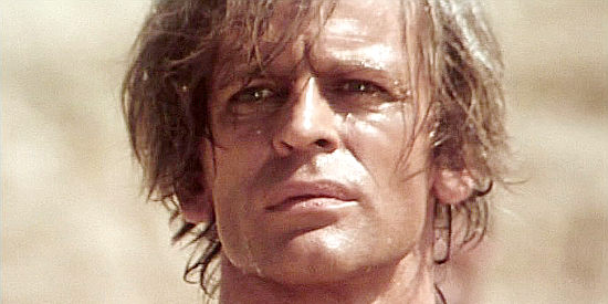 Klaus Kinski as Gary Hamilton, pardoned after 10 years in prison and determined to even the score in And God Said to Cain (1970)