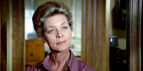 Lauren Bacall as Bond Rogers, the boarding house owner who opens her home to J.B. Brooks in his final days in The Shootist (1976)
