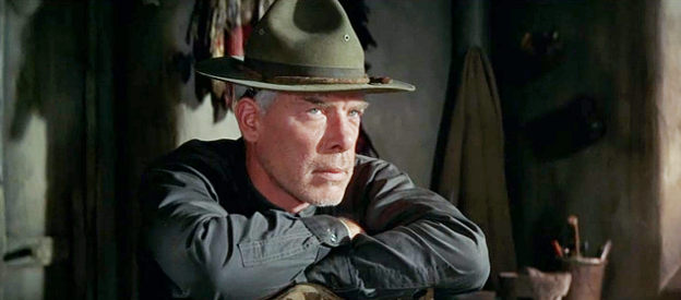 Lee Marvin as Faden, planning the raid on Raza's camp in The Professionals (1966)