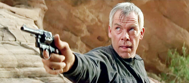 Lee Marvin as Fardan, looking for help from above when cornered by bandits in The Professionals (1966)