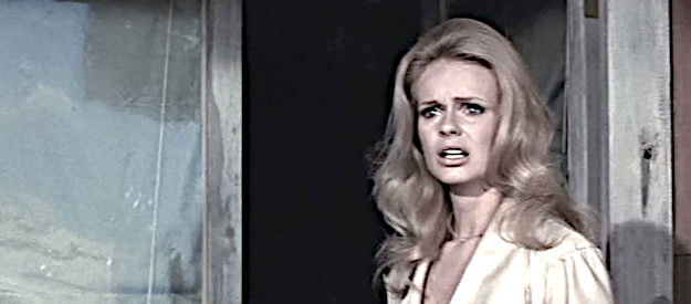 Lynda Day George as Sue McSween, fearful for her husband's safety in Chisum (1970)