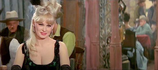 Mamie Van Doren as Olivia, enjoying a performance by Freddy in The Sheriff was a Lady (1964)