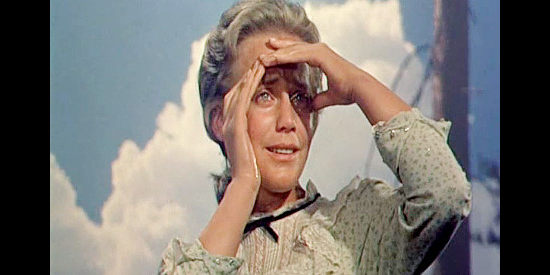 Maria Schell as Elizabeth Mahler, testing her eyes for the first time in bright sunlight in The Hanging Tree (1959)