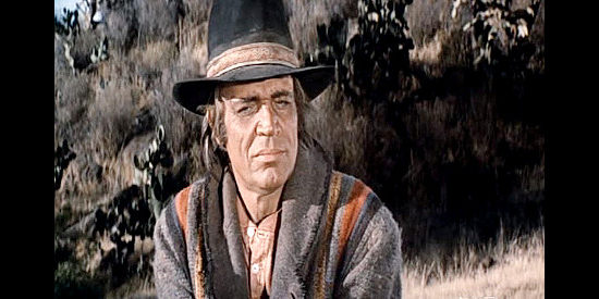 Neville Brand as Lightfoot, the half-breed tracking who helps J.D. Cahill in his pursuit of the outlaws in Cahill U.S. Marshal (1973)