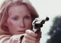Sondra Currie as Jessi, honing her six-shooting skills for the mission ahead in Jessi's Girls (1975)