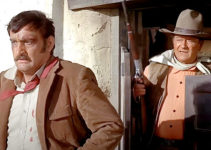 Victor French as Ketcham, under the gun of John Wayne as Cord McNally in Rio Lobo (1970)