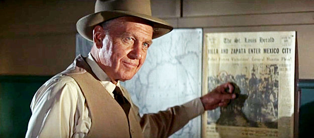 Ralph Bellamy as Grant, trying to recruit three specialists to rescue his kidnapped wife in The Professionals (1966)