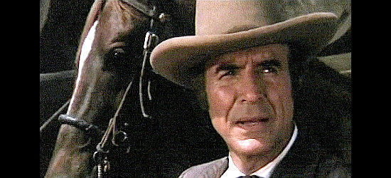 Ricardo Montalban as the pinkerton man, on the trail of stolen money in The Train Robbers (1973)