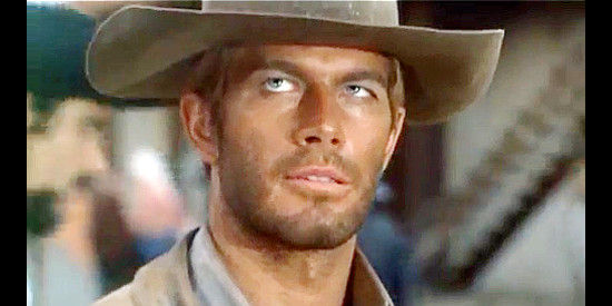 Richard Harrison as Donald Sorenson, arriving in Gold Hill for the first time in El Rojo (1966)