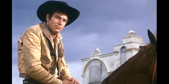 Richard Harrison as Gringo (aka Ricardo Martinez) reports an attempted ambush in Gunfight at Red Sands (1963)