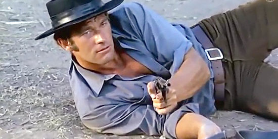 Richard Harrison as Steve McGowan springs into action in Dig Your Grave, Friend … Sabata is Coming (1971)