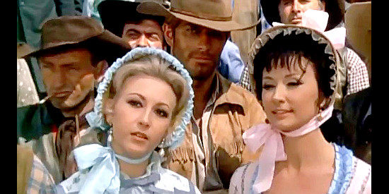 Rita Klein as Pamela and Annie Gorassini as Flo, saloon girls meeting Sorenson (Richard Harrison) for the first time in El Rojo (1966)