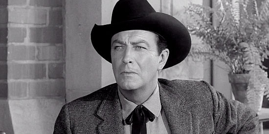 Robert Taylor as Mackenzie Bovard, disappointed to see a key witness has arrived in town in The Hangman (1960)