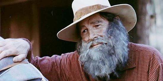 Rod Cameron as Rufe, the aging man who helps nurse Jessi back to health in Jessi's Girls (1975)